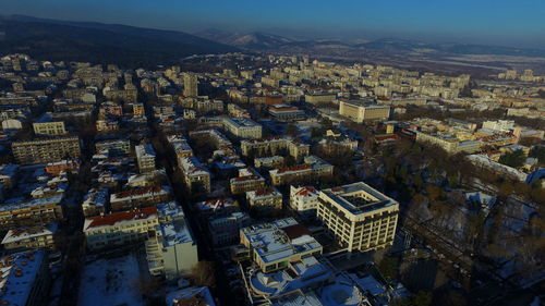 High angle view of illuminated cityscape against sky