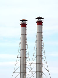 Smoke stacks against sky