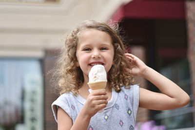 Portrait of cute girl holding ice cream