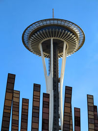 Low angle view of modern buildings against blue sky