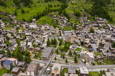 High angle view of townscape and trees in city