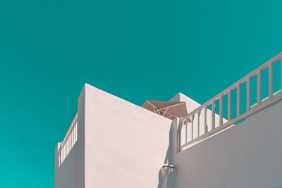 Low angle view of building against cleat blue sky