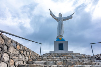 Low angle view of statue against sky