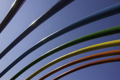 Low angle view of cables against clear blue sky