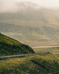 Scenic view of landscape and mountain in foggy weather