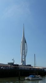 Low angle view of bridge over river against sky