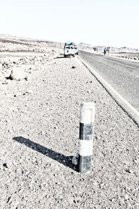 Car on road against clear sky