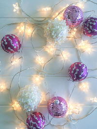 Close-up of illuminated christmas lights hanging on ceiling