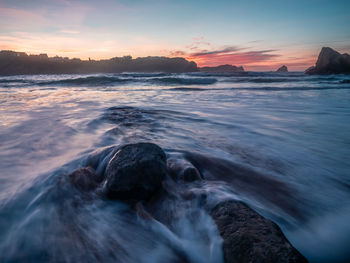 Scenic view of sea against sky during sunset