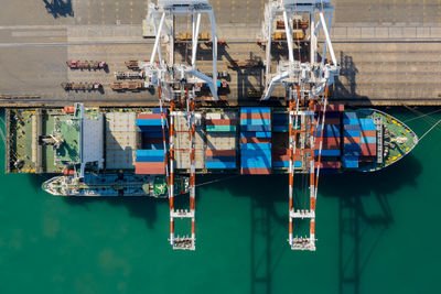 Container ship terminal, and quay crane of container ship at industrial port with shipping container 