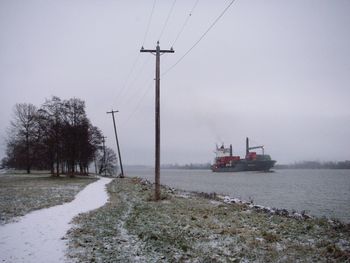 Scenic view of land against sky during winter