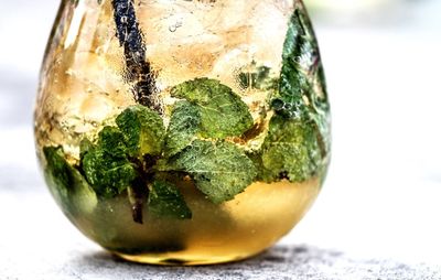 Close-up of lemon in glass on table