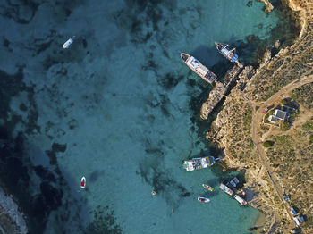 Aerial view of boats moored at beach