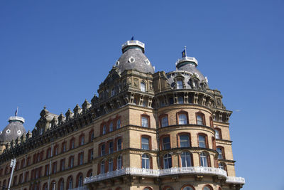 The grand hotel in scarborough, uk on a clear blue sky sunny day