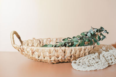 Wicker straw basket made of recycled materials. sustainable shopping and home. recycled material