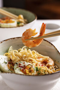 Traditional asian food, ramen soup with shrimps