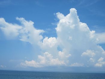 View of calm sea against cloudy sky