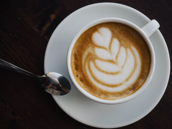 High angle view of cappuccino on table