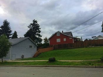House and buildings against sky
