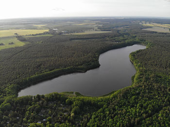 High angle view of river amidst landscape against sky