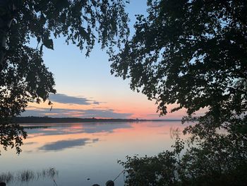 Scenic view of lake against sky during sunset