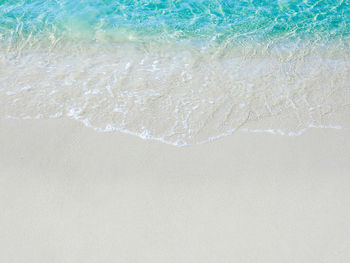 High angle view of surf on beach