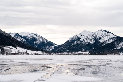 Scenic view of snowcapped mountains against sky