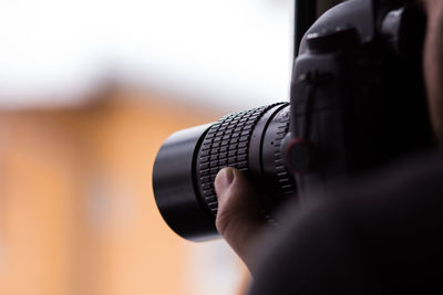 Close-up of hand holding camera