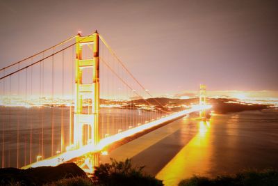 View of suspension bridge at sunset