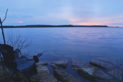 Scenic view of lake at sunset