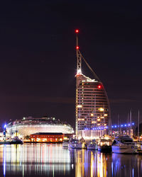Illuminated buildings at waterfront