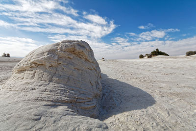 Rock formation on land against sky