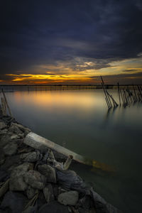 Scenic view of lake against sky during sunset