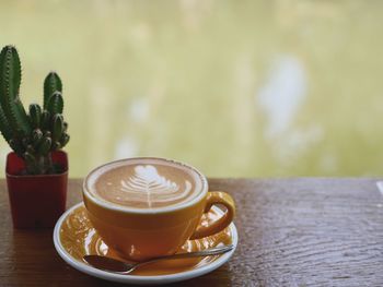 Close-up of cappuccino on table