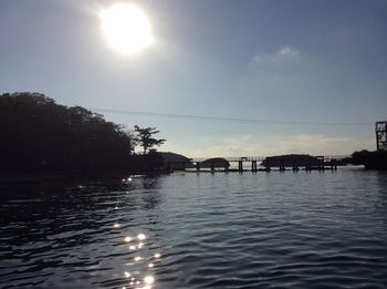 Scenic view of river at sunset