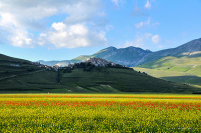 Scenic view of castelluccio village against sky
