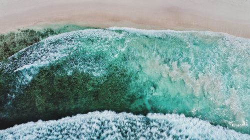 Aerial view of waves on beach 