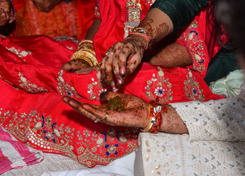 Midsection of woman with red umbrella