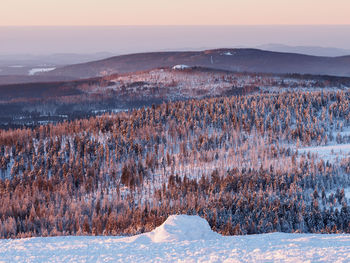 Aerial view of landscape against sky during winter