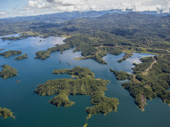 Aerial view of lake and mountains against sky