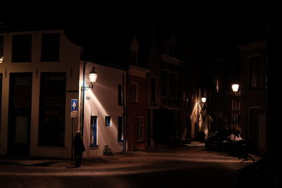 Buildings in city at night