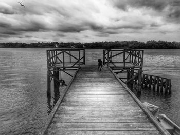 Pier over sea against sky