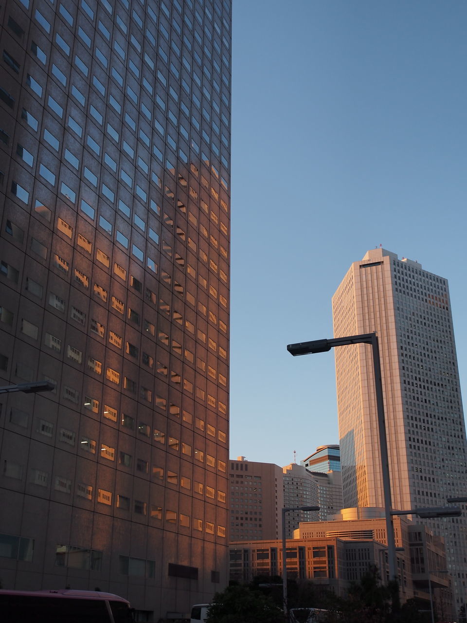 building exterior, architecture, built structure, city, men, full length, lifestyles, walking, low angle view, outdoors, day, building, sunlight, shadow, leisure activity, city life, silhouette, standing