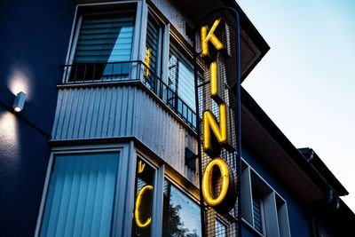 Low angle view of illuminated building against sky