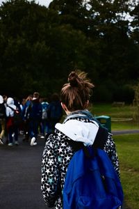 Rear view of man walking in park