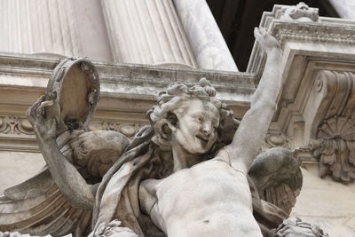 Close-up of an angel from the sculptural group of the dance at the opera garnier