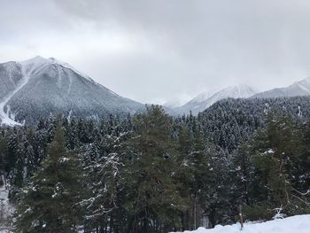 Scenic view of mountains against sky during winter