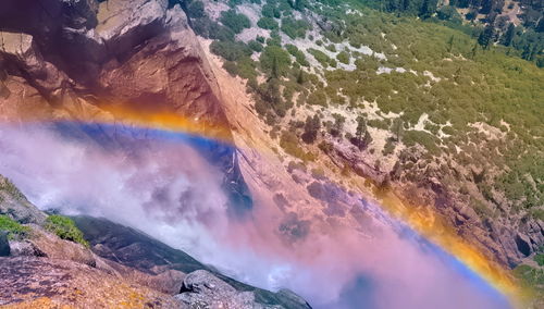 High angle view of rainbow over mountain