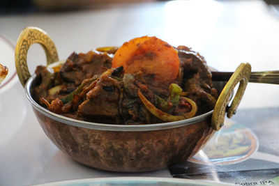 Close-up of food served in container on table