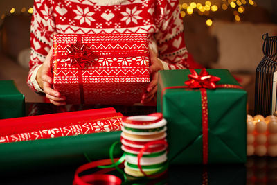 Midsection of woman holding gift